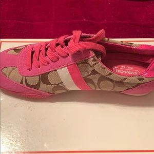Pink Coach shoes.